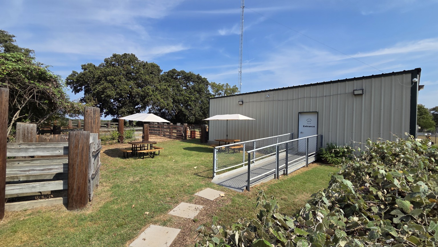 Outdoor seating and accessible entrance to the Bakalian Family Distilling tasting room