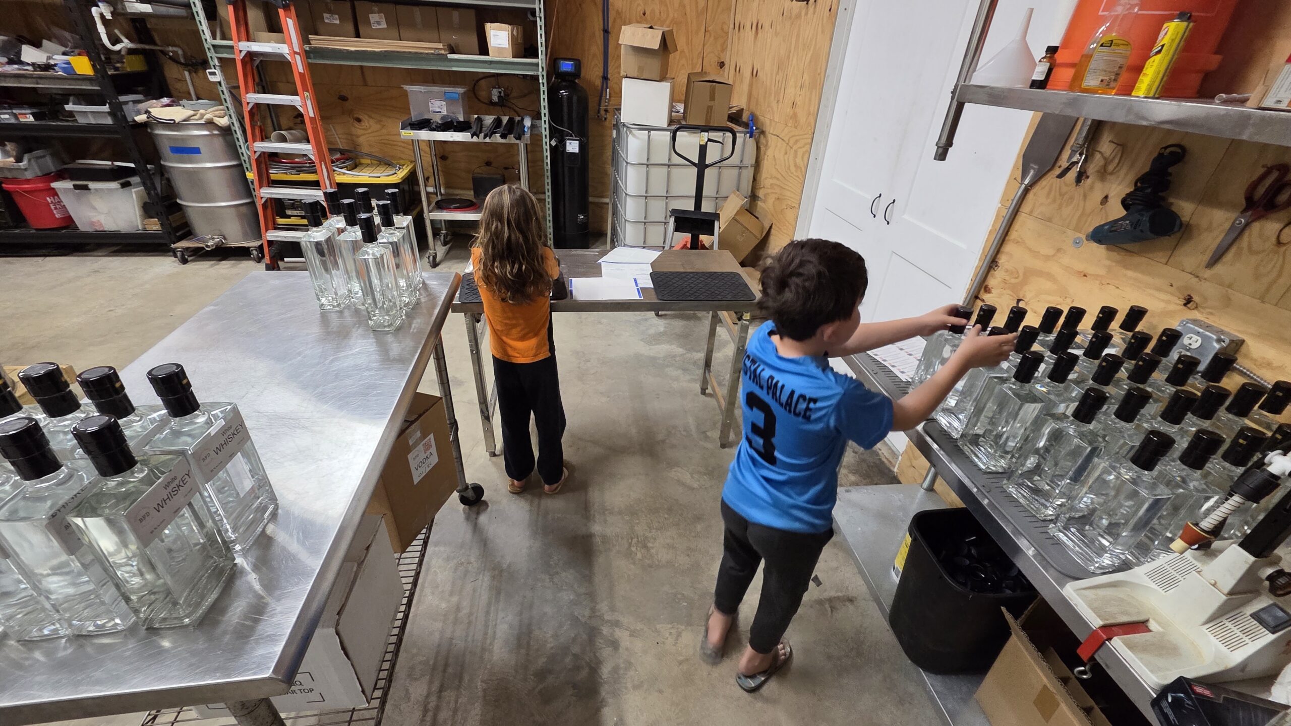 Family exploring the Bakalian Family Distilling tasting room